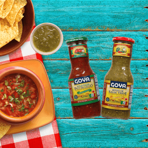 Various Goya Salsa with chips and salsas next to it.