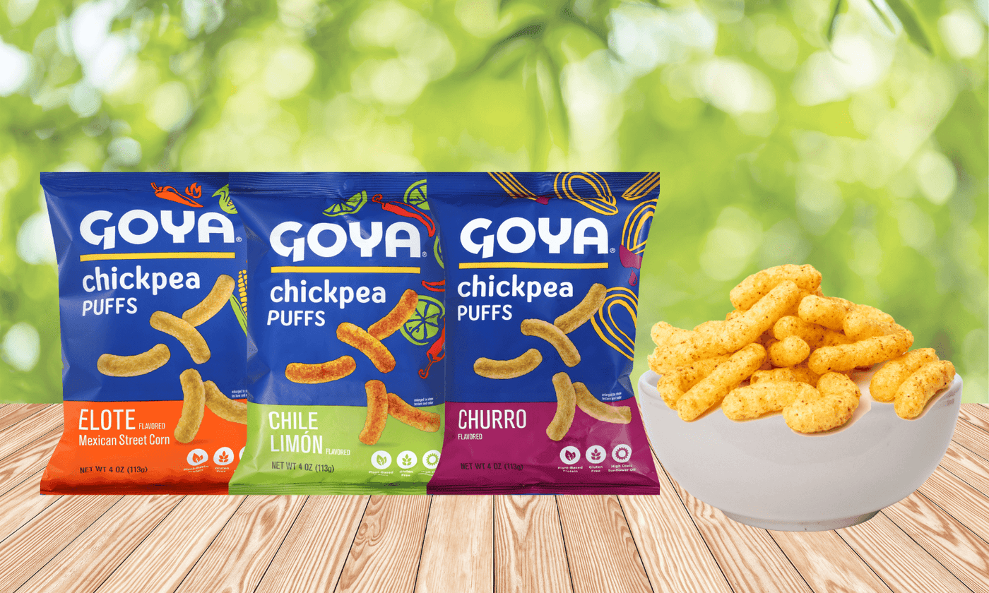 various Goya chick puffs with a bowl of chickpea puffs next to it on a wooden table