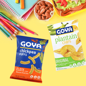 Various Goya products in yellow background with pencils, note books, almond and lunch.